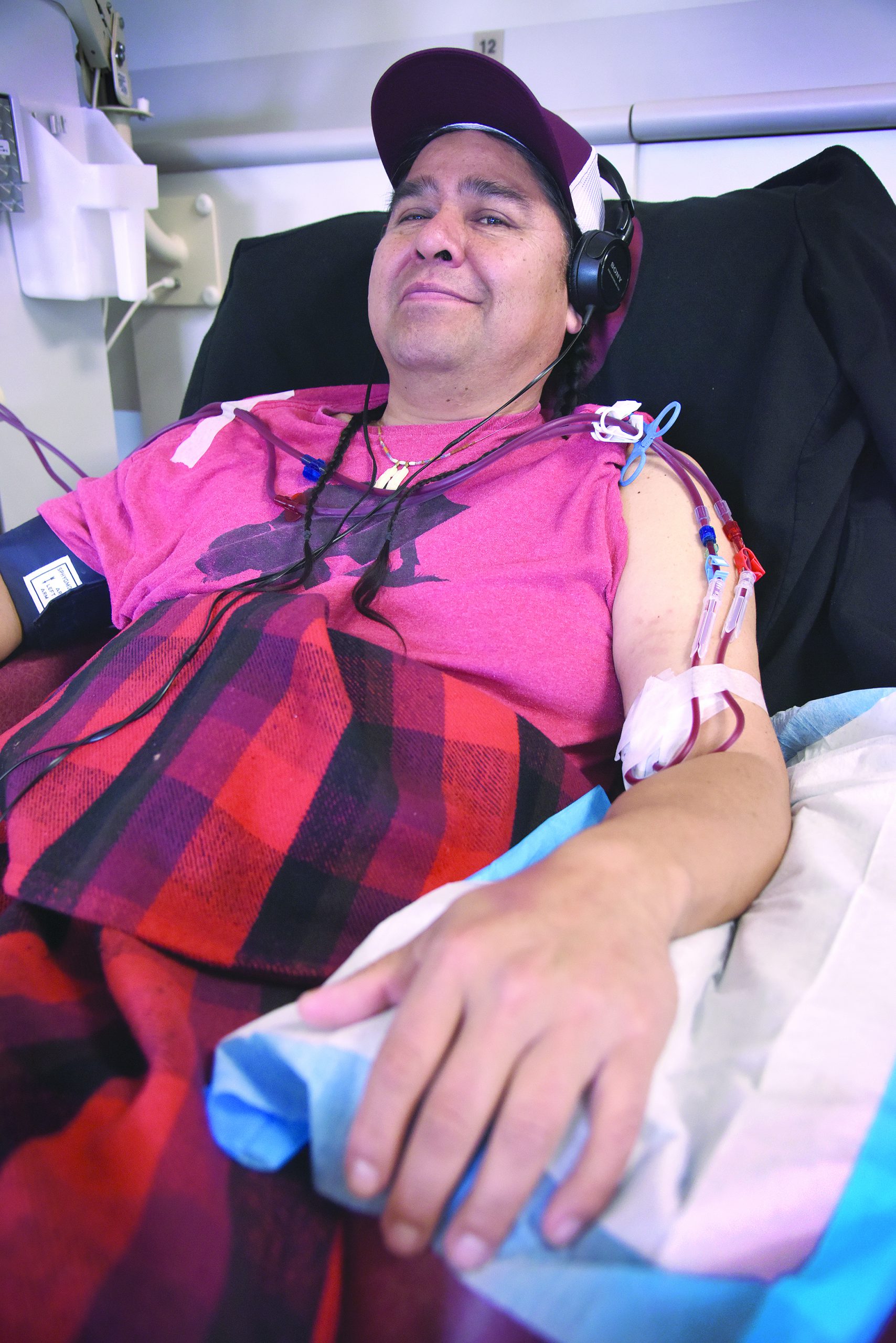 Wus Gone sits in a chair at the DaVita Dialysis Center on the Umatilla Indian Reservation. Gone spends four hours, three days a week, on a machine that does the work his kidney is supposed to do. He was born with one kidney and it no longer functions. Now he’s waiting for a kidney transplant.