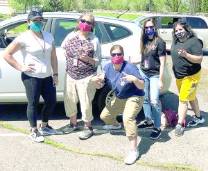 Some of the staff from the Department of Children and Family Services at the food distribution May 1 included, from left, Kola Shippentower, Kathleen Peterson, Dionne Bronson, Taylor Jerome, and Julie Taylor.