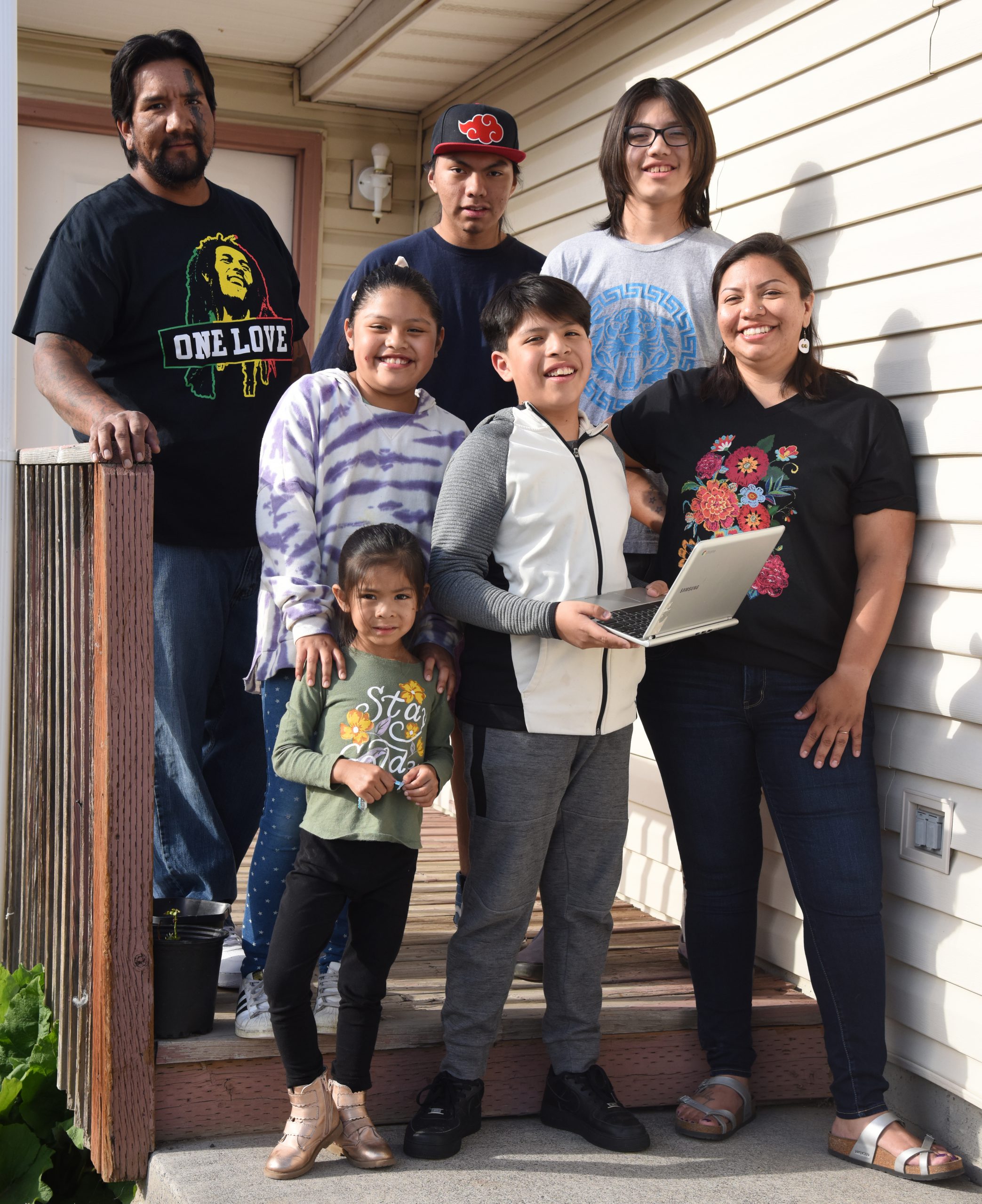 Talia Tewawina, bottom right, is a warrior mom, keeping her five children on track during the COVID-19 pandemic with a daily schedule that includes schoolwork, chores, exercise and freetime while she works a part-time job at Yellowhawk Tribal Health Center on the Umatilla Indian Reservation. The family, which lives in Pendleton, includes husband Andrew, plus the children, Midnight Rose Tewawina at the bottom, Ayanna and Ayden Star in the middle next to their mother, and Anthony and Leo Crawford on the top step.