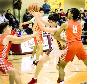 Basketball player on the offense breaking through two screens.